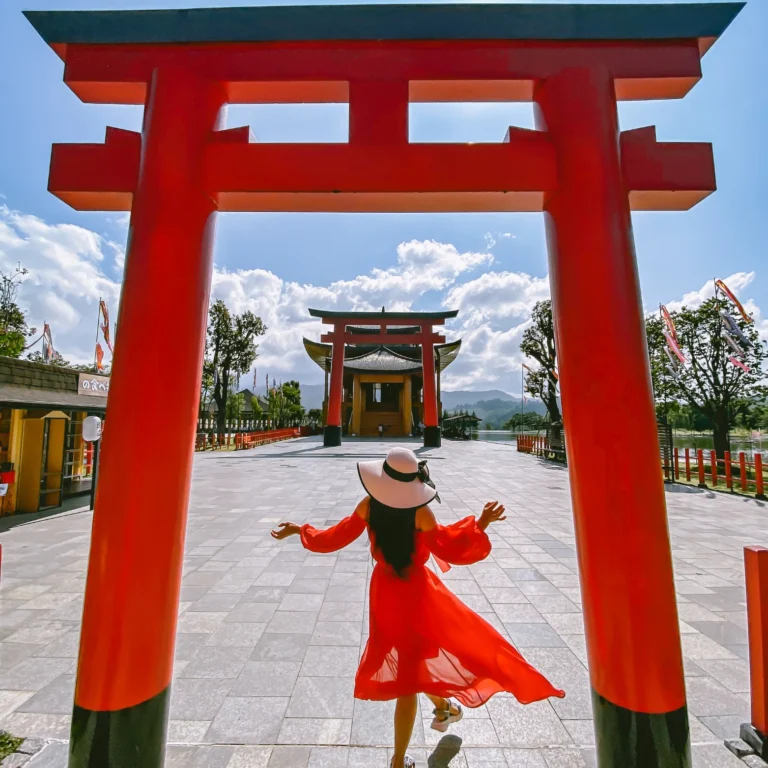woman in front of japanese torii