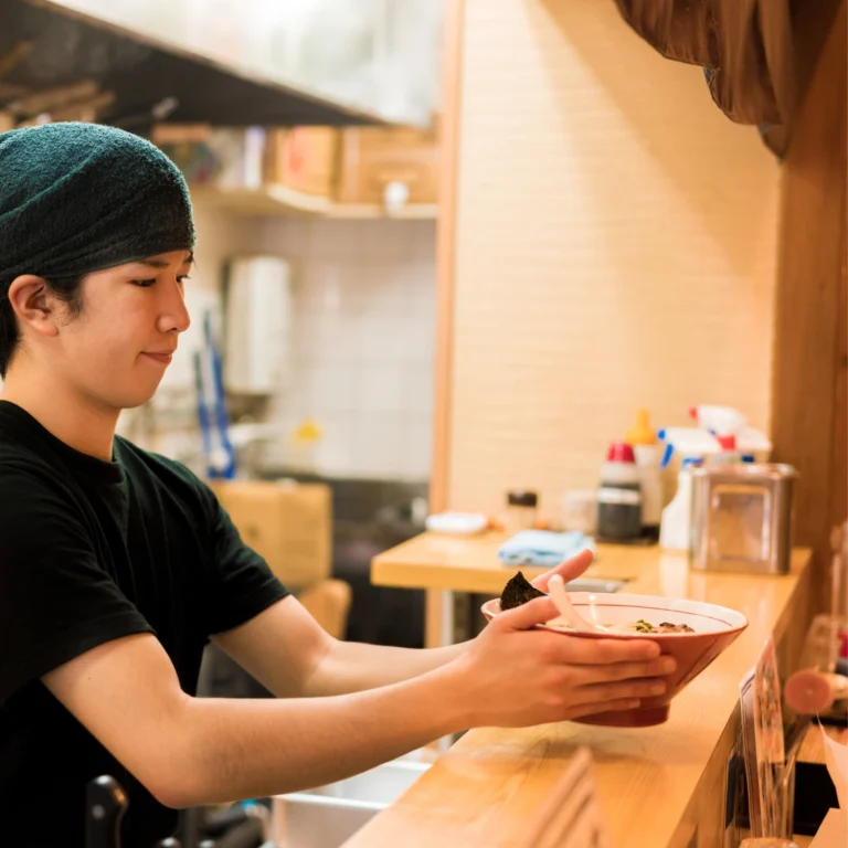 woman working in ramen shop in japan